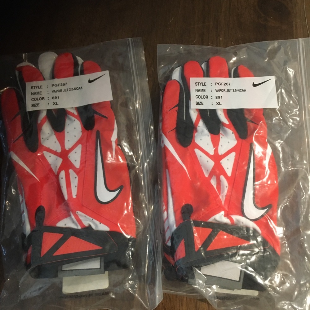 Two pair Nike football gloves size XL